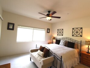 Spacious master bedroom with slider to furnished patio.