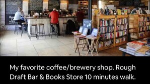 A cozy cafe with exposed wooden beams, a bar area, and a small book section. - Historic Rustic Kingston Home. (KINGSTON)