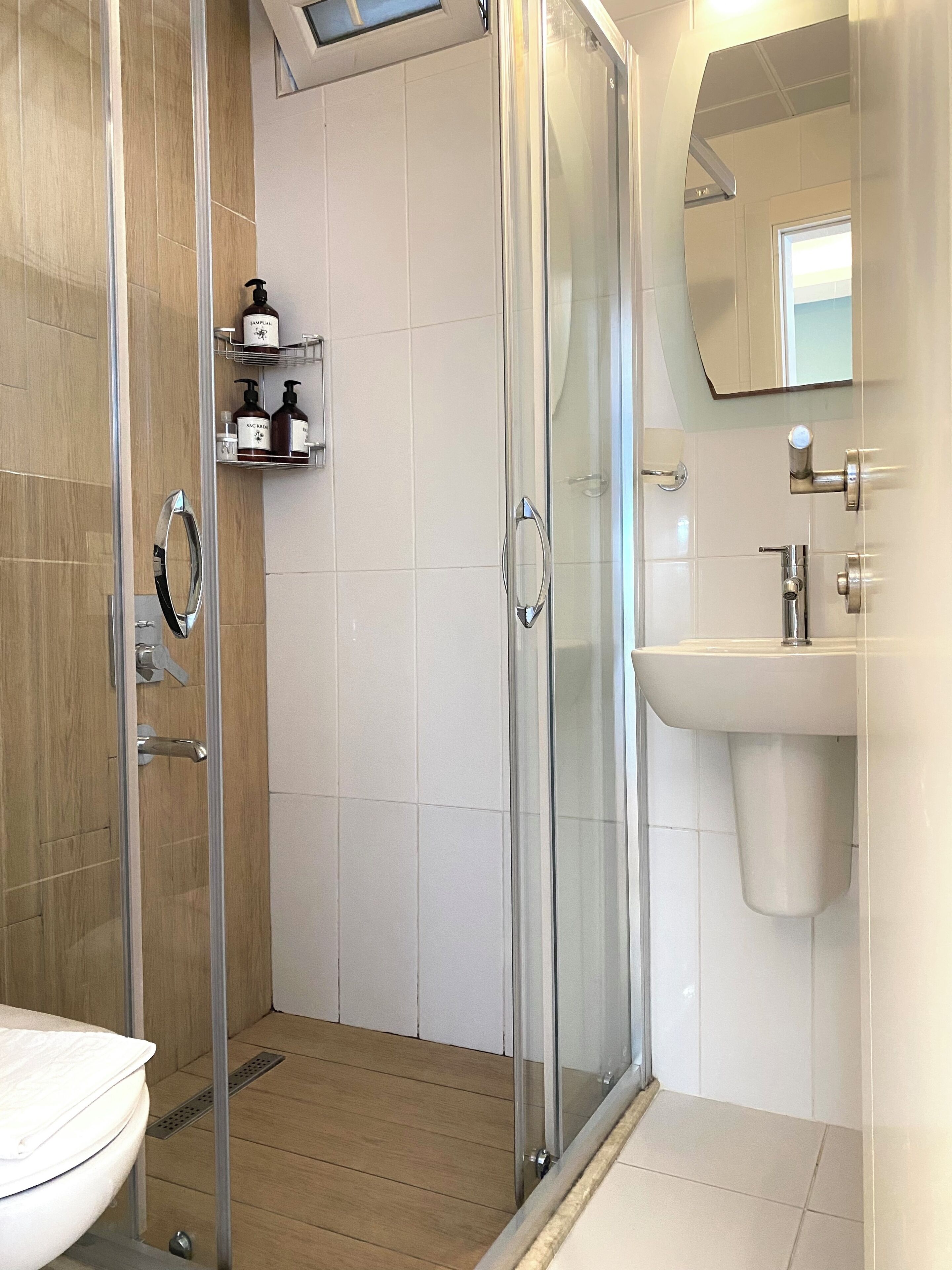 shower, rainfall showerhead, designer toiletries, hair dryer