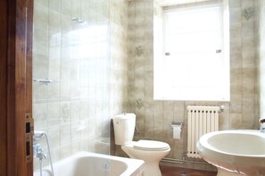 Bathtub, bidet, towels, soap