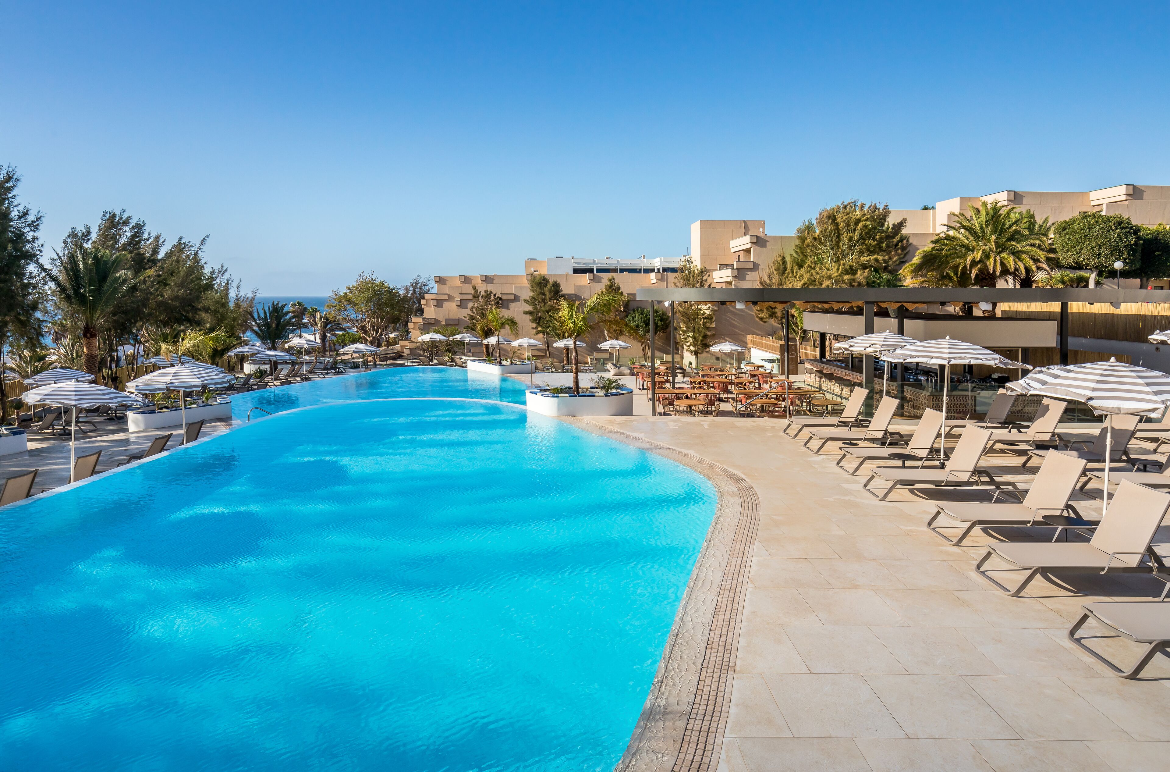 12 outdoor pools, pool umbrellas, sun loungers