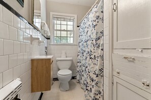 Bathtub, hair dryer, towels