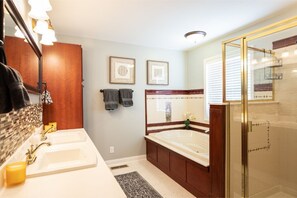 Bathtub, hair dryer, towels, shampoo