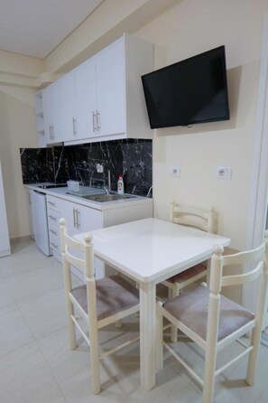 Triple Room, Balcony | Private kitchen