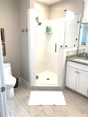 Bathtub, towels, soap, toilet paper