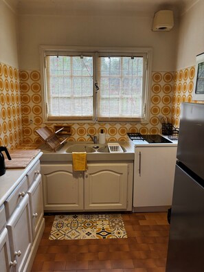 Fridge, microwave, stovetop, coffee/tea maker