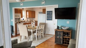 A compact living space with a kitchen, dining area, and seating area.
