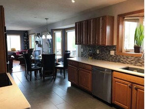 Enjoy meals in the kitchen with a dining area and sink.