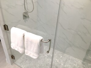 Shower, hair dryer, towels, toilet paper
