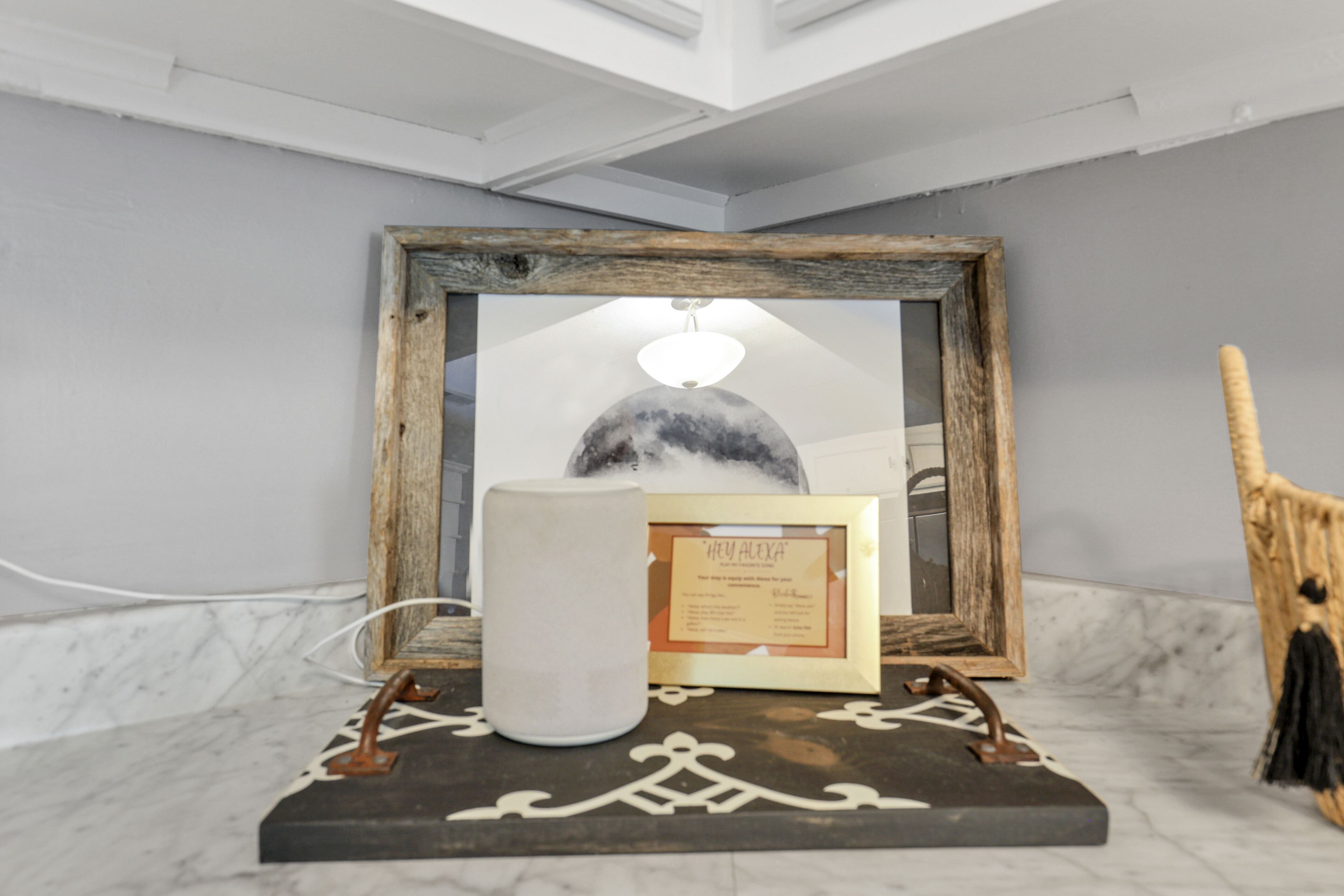 A framed picture with a candle holder in front of it.