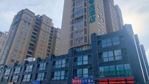 A multi-story hotel building with a sign indicating it is a hotel. - Greentree Inn Express Jiangsu Suqian Shuyang County Bus Station (Suqian)
