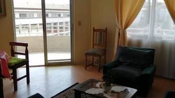 Family Apartment | Living room | 24-inch flat-screen TV with digital channels, TV