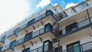 A multi-story building with a sign for Morgan Residences. - Studio Apartment I Full Equipped I Lovely and Confort (Cabo San Lucas)