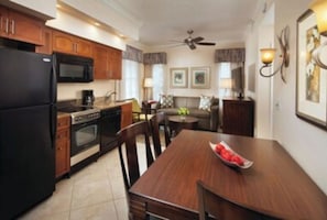 Enjoy cooking and dining in this well-appointed kitchen with modern appliances and a dining area.