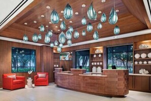 Welcome to our reception area, featuring a spacious desk and comfortable seating for guests.
