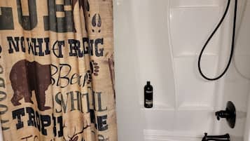 Combined shower/bathtub, towels, soap