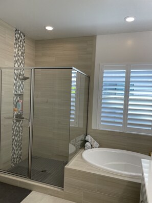 Combined shower/tub, hair dryer, towels, soap