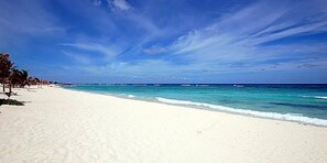On the beach, sun-loungers, beach towels