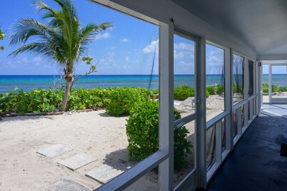Private, quiet oceanfront home, wrap-around screened porch. Relax on 1+ acres