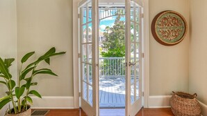 A door leading to a balcony with a view of a residential area. - Close to Historic Downtown, River, Kayaks Included with Short Walk to Launch, $300 in Free Tickets! (St. Augustine)