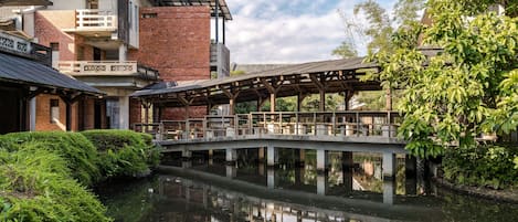 Experience tranquility amidst lush greenery and a serene riverside setting.