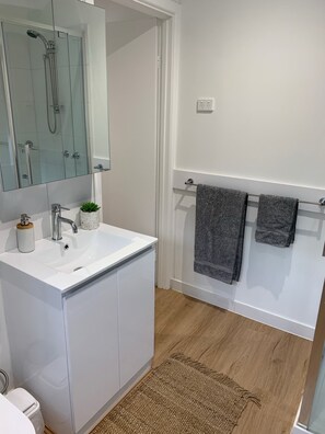 Bathtub, hair dryer, towels, soap