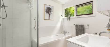 Bathtub, hair dryer, towels, soap