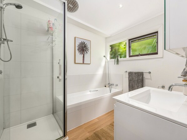 Bathtub, hair dryer, towels, soap