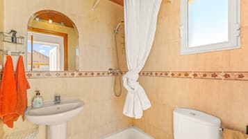 Bathtub, hair dryer, towels