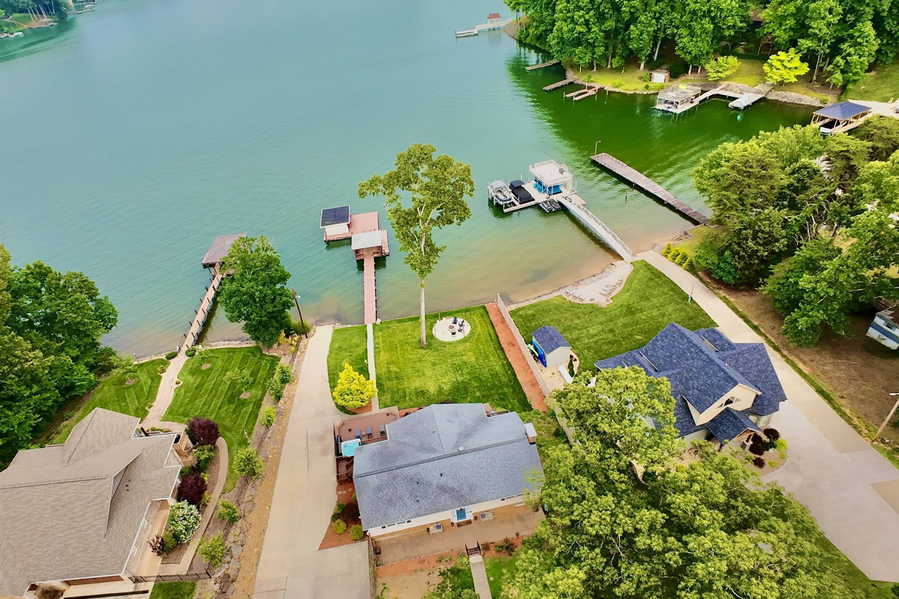 A residential area with houses, a dock, and a small boat.