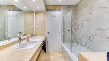 Bathtub, hair dryer, towels