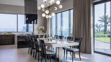 Penthouse | Private kitchen | Full-sized fridge, microwave, coffee/tea maker, electric kettle