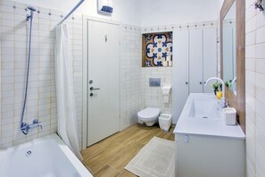 Bathtub, hair dryer, towels, soap