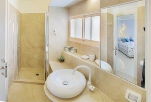 Bathtub, hair dryer, towels, soap