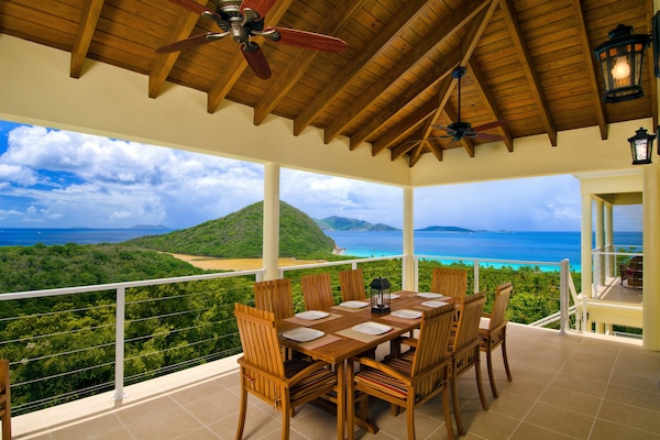 Outdoor dining space with beautiful views, Belmont Pond in the background