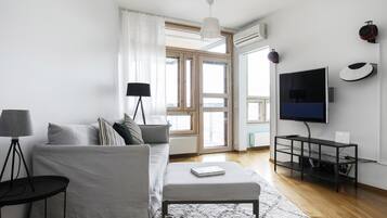 Deluxe Apartment | Living area | TV