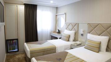 Superior Twin Room | Minibar, in-room safe, desk, laptop workspace