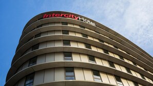 A curved hotel building with the name 'Intercity Hotel' on the top. -  Intercityhotel Amsterdam Schiphol Airport (Hoofddorp)