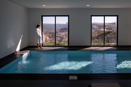 Indoor pool, seasonal outdoor pool, pool umbrellas, sun loungers
