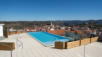 Indoor pool, seasonal outdoor pool, pool umbrellas, pool loungers