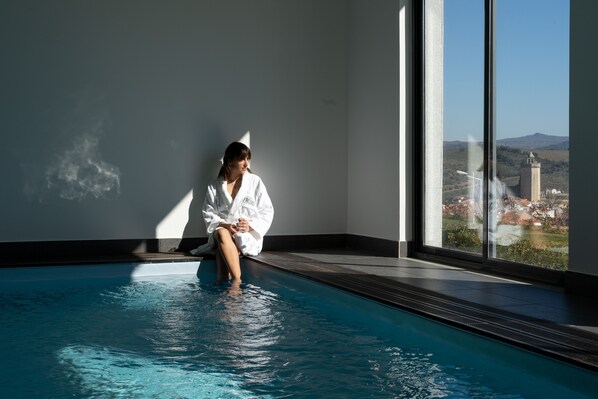 Indoor pool, seasonal outdoor pool, pool umbrellas, sun loungers
