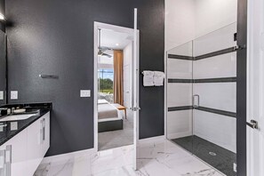 Shower, hair dryer, towels, soap