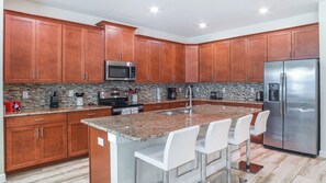 Microwave, oven, stovetop, dishwasher - Rent This Luxury 5 Star Villa on Storey Lake, Orlando Villa 5482 (Kissimmee)