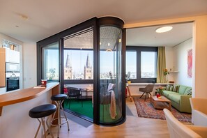 Interior - Roof-top panorama suite with distant views over Vienna (Wien)