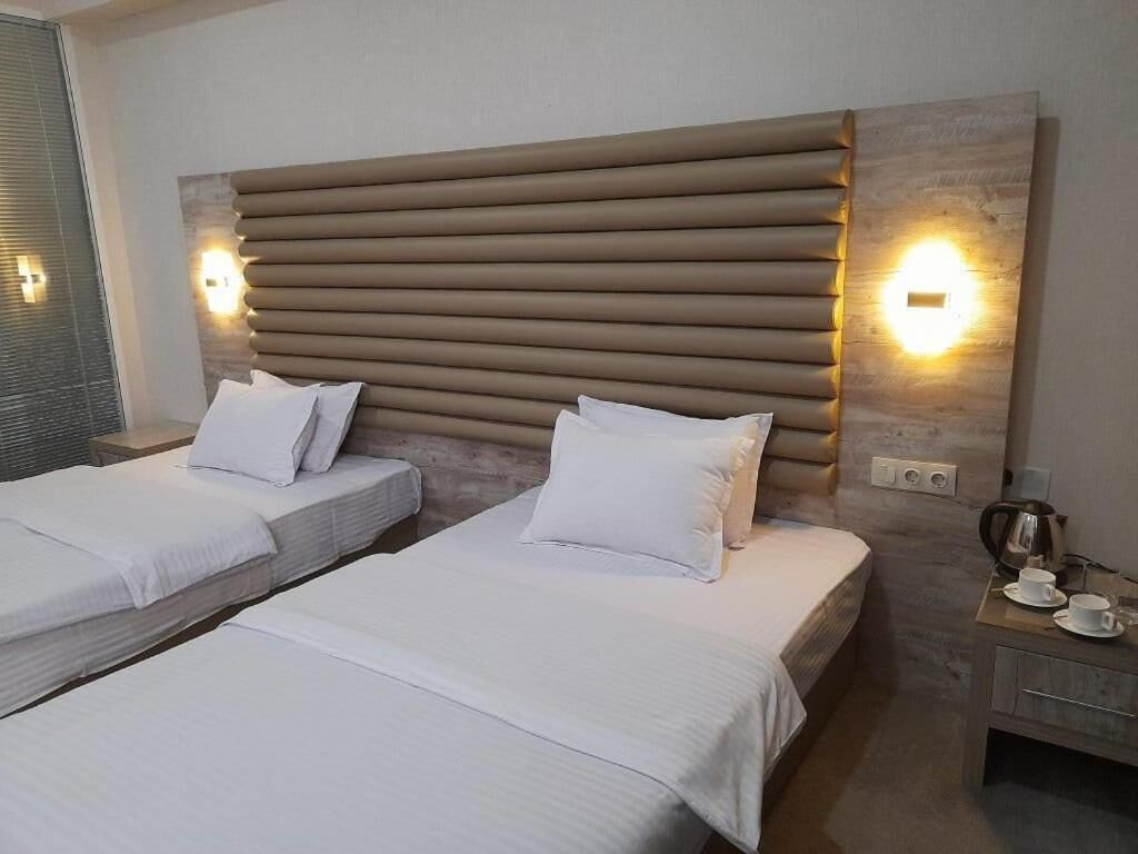 Premium bedding, down duvets, free minibar items, in-room safe