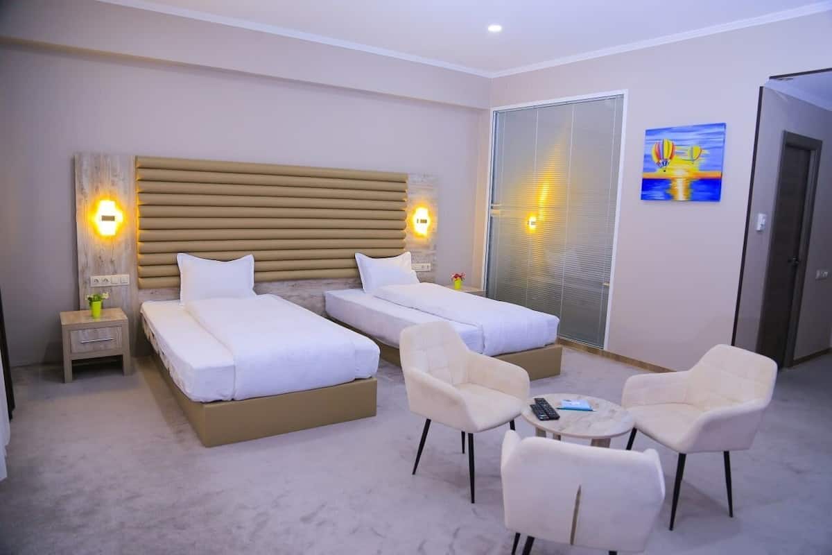 Premium bedding, down duvets, free minibar items, in-room safe