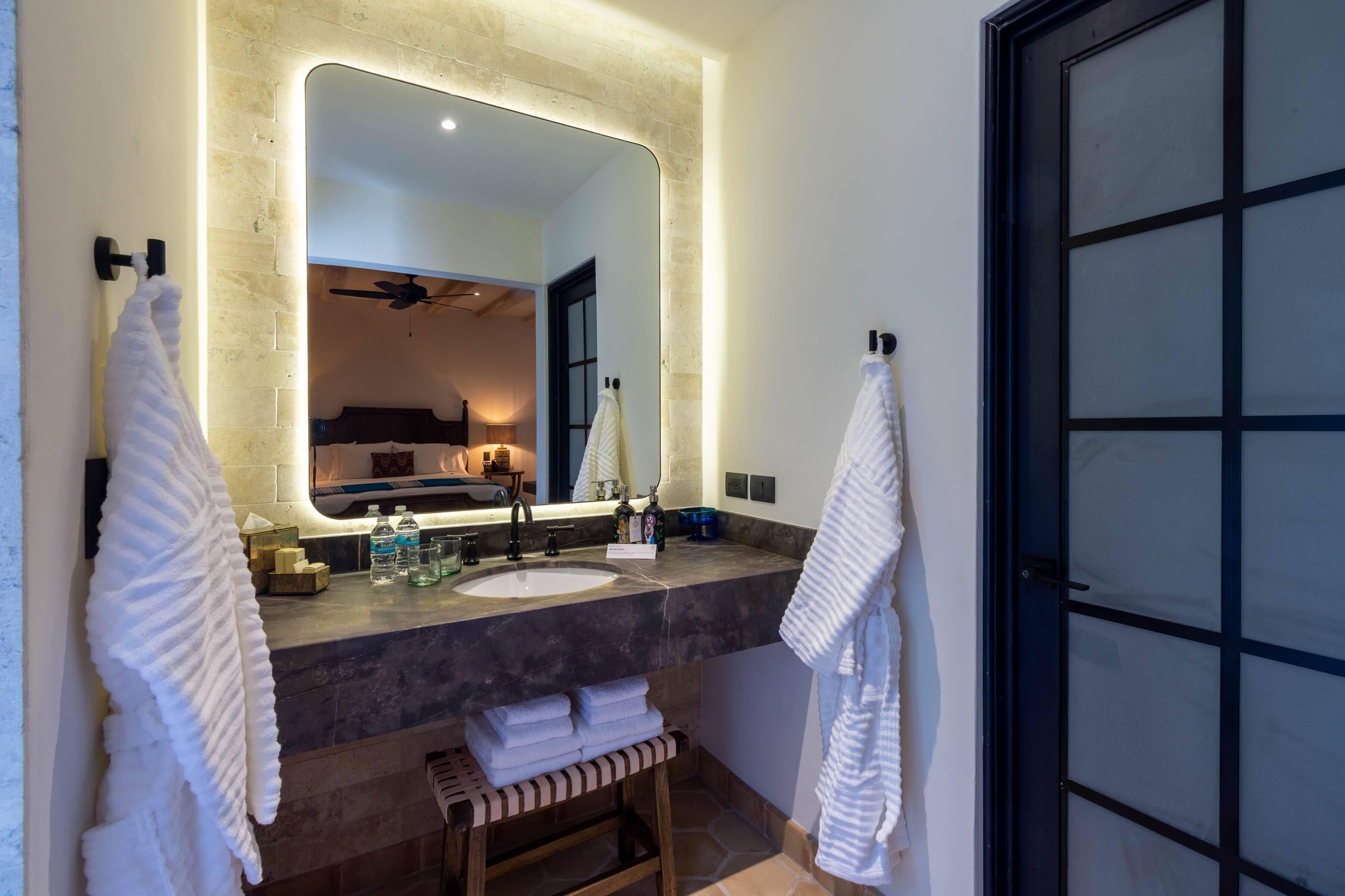 deluxe room | bathroom | designer toiletries, hair dryer, bathrobes, slippers