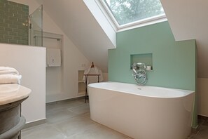 Bathtub, hair dryer, towels, soap