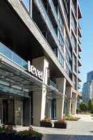 A modern building with a glass facade and the word "level" prominently displayed.