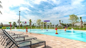 A pool area with lounge chairs, water features, and a clear sky. - 4825 LL - Storey Lake - 5BD/4BA Private Pool (Kissimmee)